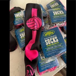 NBW still in packaging. 12 black and pink volleyball socks.